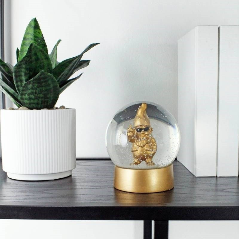 Cheeky Gnome Snow Globe in bronzed gold