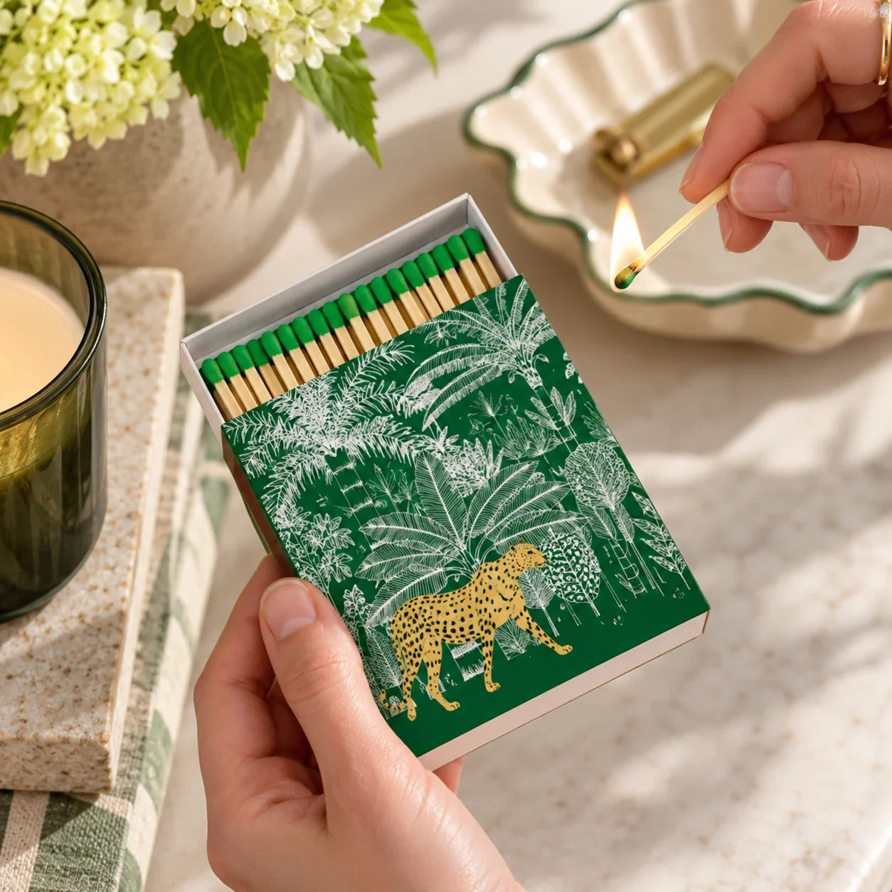 Cozy_Leopard_Matchbox_with_Lit_Match - NZ Bolt of Cloth